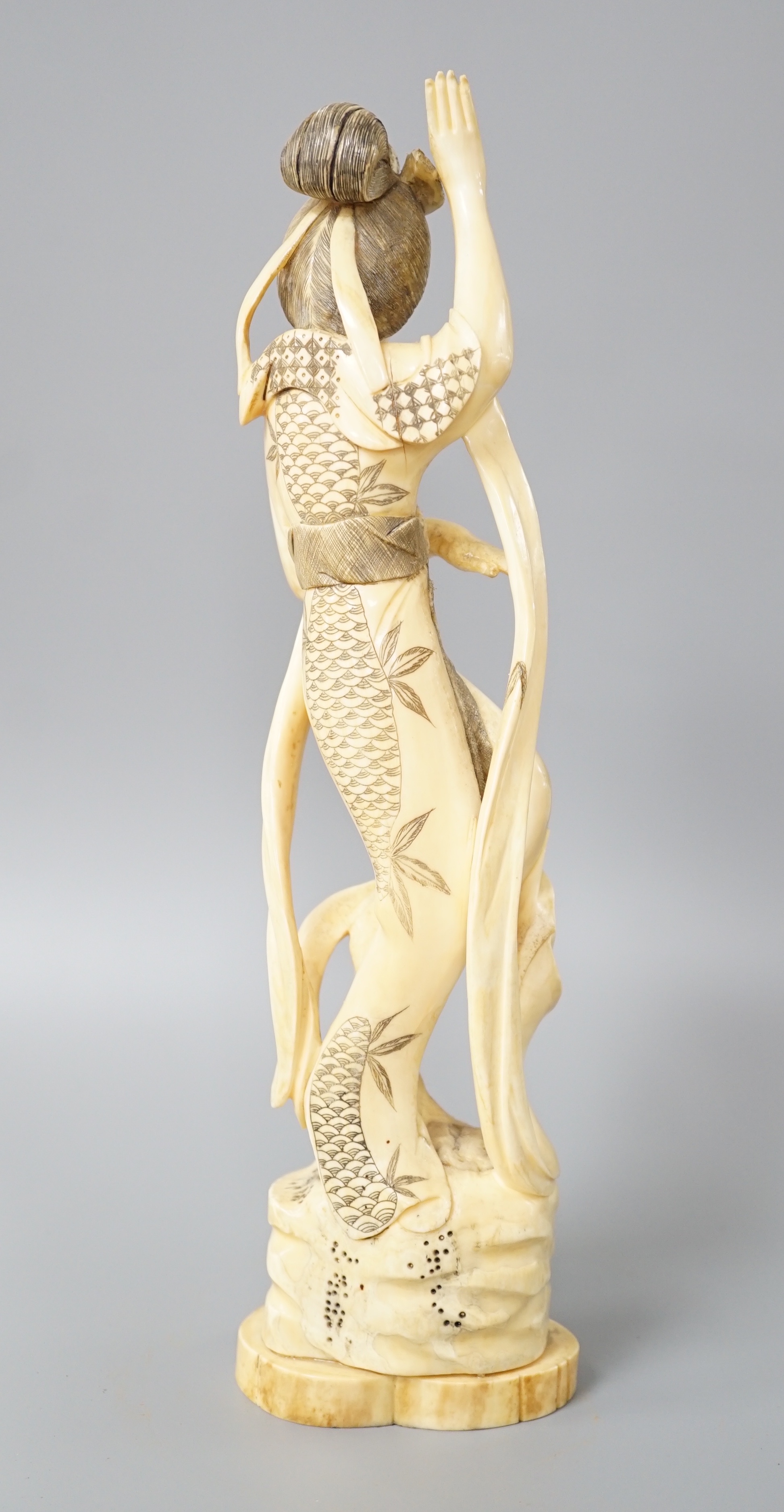 A Japanese walrus ivory figure of Seiobo, the Queen Mother of the West, early 20th century 28cm